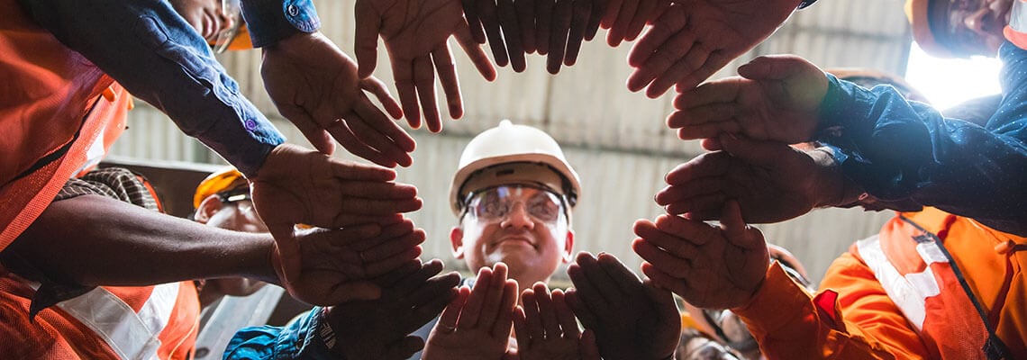 Group of hands touching in circle